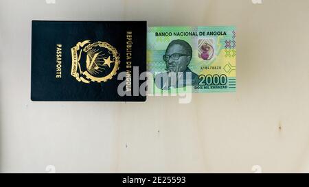 An Angolan passport and new series of angolan banknotes of kwanza Stock ...