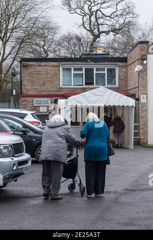 Ruislip, UK.  12 January 2021.  Patients enter a coronavirus vaccination centre at the Ruislip Young People’s Centre in Ruislip, north west London.   This Community Vaccine Hub is one of two which have been set up in the London Borough of Hillingdon (the other is in Hayes).  So far, approximately 2.3m people in the UK have received their first dose of the vaccine as at 10 January.  Credit: Stephen Chung / Alamy Live News Stock Photo