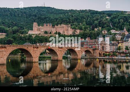 Heidelberg old bridge over Neckar river after sunset in summer Stock Photo