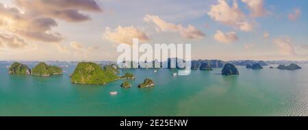 Aerial view panorama of floating fishing village and rock island, Halong Bay, Vietnam, Southeast Asia. UNESCO World Heritage Site. Junk boat cruise to Stock Photo