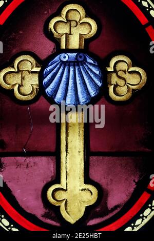 Stained glass window. Christian cross.  France. Stock Photo