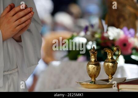 Catholic church during covid-19 epidemic. Sunday mass. Holy Communion.  France. Stock Photo