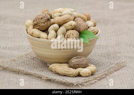 walnuts and peanuts in a bowl Stock Photo