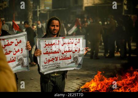 Gaza, Palestine. 12th Jan 2021. Palestinians protest against reduction of the UN Relief and Works Agency for Palestine Refugees 'UNRWA' services provided by the Palestinian refugees, in the Jabalya refugee camp, in Gaza, Palestine, on January 12, 2021. Photo by Ramez Habboub/ABACAPRESS.COM Credit: Abaca Press/Alamy Live News Stock Photo