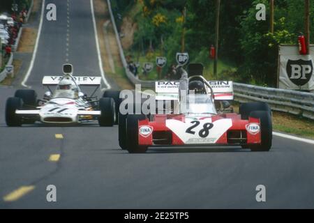 Andrea de ADAMICH and Brian REDMAN driving respectively Surtees-Ford and McLaren-Ford F1 cars in full speed on the rising straight line during 1972 Grand Prix de France, in Charade circuit near Clermont-Ferrand. Stock Photo