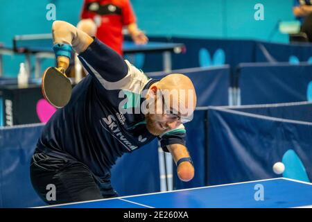 Elderly and disabled people playing table tennis Stock Photo