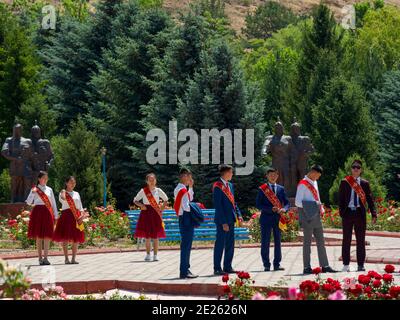 High school graduates are celebrating their graduation.  Memorial Place Manas Ordo near Talas in the  Tien Shan mountains. Manas, a mystical as well a Stock Photo