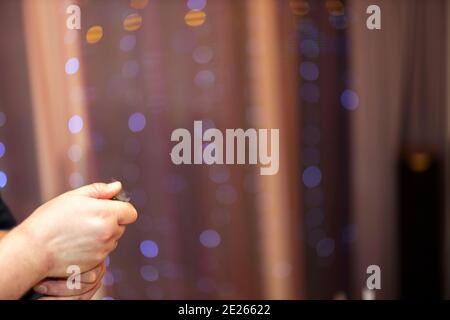 Close up view of male hands opening bottle of wine. Holidays. Alcohol. Stock Photo