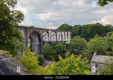 The disused Ingleton railway viaduct crosses the valley of the River Greta in the Yorkshire Dales Stock Photo