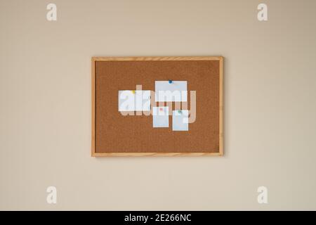 cork board with blank papers wooden frame. notes. colourful pin and paperclips . reminder. pin board. isolated. new year's resolution, goals. to do li Stock Photo