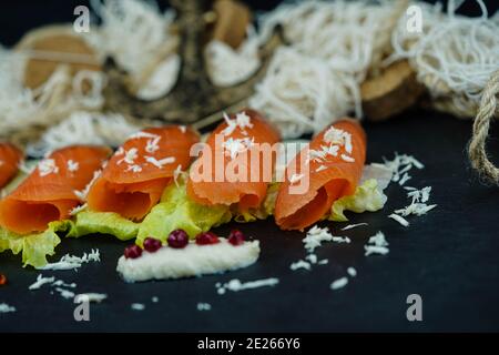 smoked norwegian Salmon in front of a fishing net Stock Photo