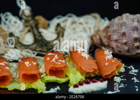 smoked norwegian Salmon in front of a fishing net Stock Photo