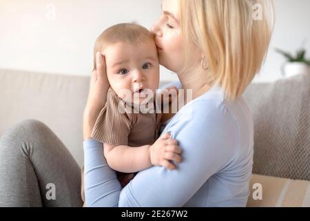 Beautiful lady bonding with her adorable baby Stock Photo