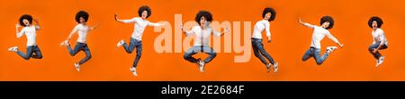 Guy Jumping And Having Fun Posing In Mid-Air, Orange Background Stock Photo