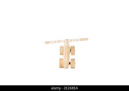 Wooden airplane made for coloring by his children. Isolated in a white background. Close-up. Stock Photo