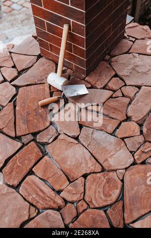 Professional installation of tiles on glue - high quality exterior finishing works Stock Photo