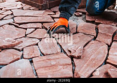 Professional installation of tiles on glue - high quality exterior finishing works Stock Photo