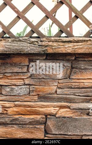 Professional cladding of stone tiles on the facade of the house - natural stone Stock Photo