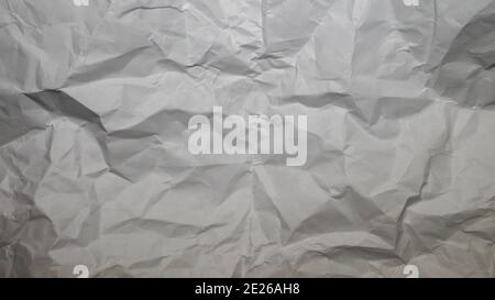Crumpled white paper, crumpled paper background, paper texture, background blank for copy space. Geometric paper. Stock Photo
