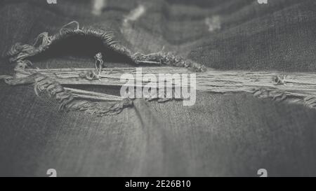 Denim texture, ripped jeans, stylish denim wallpaper. Stock Photo