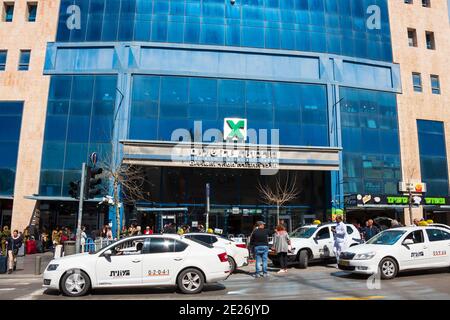 JERUSALEM, ISRAEL - MARCH 10, 2019: Jerusalem Central Bus Station building and taxi cars and people crowd in front of it. This bus station, located on Stock Photo