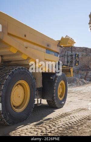 Brand new mining tractor working in open pit mining Stock Photo