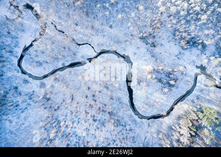 Aerial view of White River at sunset with a bridge spanning the water ...