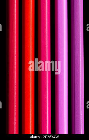 cold colored wooden pencils, vertical view from above, black background Stock Photo