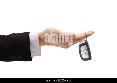 Male hand holding a car key with a key ring isolated on white background Stock Photo