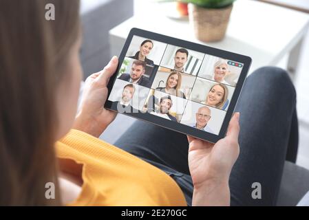 Video conference with multiple employees. Tablet application for remote work and study from home. Stock Photo