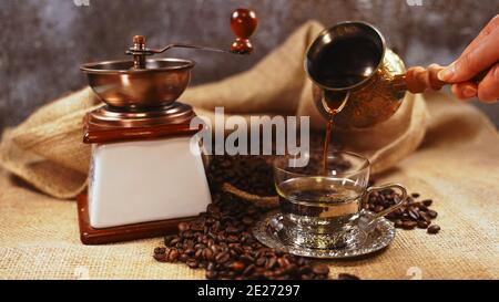 Turkish coffee pouring from a cezve. Stock Photo