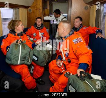 The STS-135 crew ride in the Astrovan to Launch Pad 39A to board space shuttle Atlantis on the morning of Friday, July 8. The launch of Atlantis on the STS-135 mission is the final flight of the Space Shuttle Program. Clockwise from the left are: Sandra Magnus, Rex Walheim, commander Chris Ferguson and pilot Doug Hurley. In the back of the van in white is a member of the closeout crew, whose members assist the astronauts with final preparations for launch. Photo by NASA via ABACAPRESS.COM Stock Photo