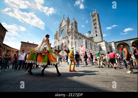 Historical parade in front of Cathedral (Duomo di Siena) before Siena Palio race, Siena, Tuscany, Italy Stock Photo