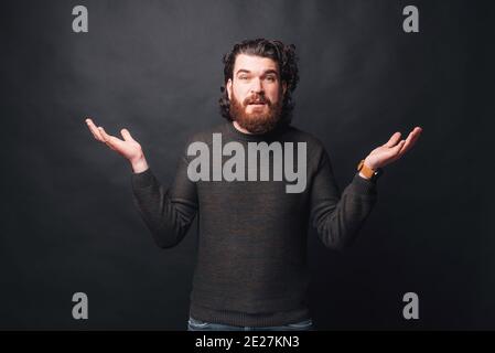 Photo of man dont know what to do and looking at the camera. Stock Photo