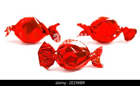 Candy With Reed Wraapping Three Red Wrapped Candy Isolated on a White Background Stock Photo - Alamy