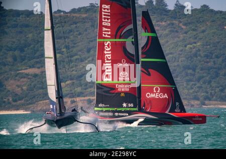 Auckland, New Zealand, 12 January, 2021 -  New York Yacht Club American Magic, skippered by  Terry Hutchinson,  tacks ahead  of Emirates Team New Zealand, skippered by Peter Burling, during a practice race on the Waitemata Harbour ahead of the The Prada Cup competition starting on January 15, 2021 Credit: Rob Taggart/Alamy Live Stock Photo