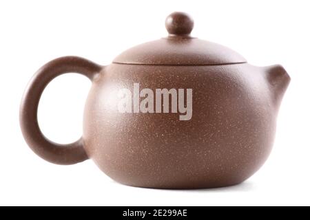 Little Chinese brown clay teapot for tea ceremony isolated on white background side view Stock Photo