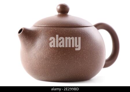 Chinese brown clay teapot isolated on white background closeup Stock Photo