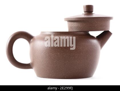Chinese teaware. Brown clay teapot with lid off isolated on white background side view closeup Stock Photo