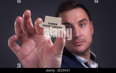 Business, Technology, Internet and network concept. Young businessman shows the word: Career opportunities Stock Photo