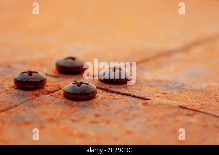 Grunge metal rust texture, rusted and oxidized metal background with bolts. Old metal iron panel surface. Stock Photo