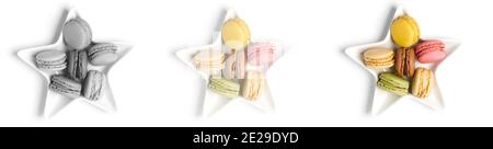Colorful sweet small macarons on plate star on white background from black and white to colorful banner Stock Photo