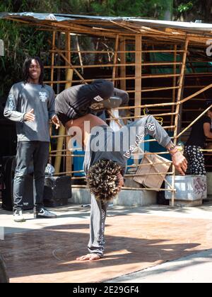 MEDELLIN, COLOMBIA - Jan 05, 2021: Medellin, Antioquia, Colombia - December 23 2020: Young Man Break Dance in Black and Grey Outfits in the Comuna 13 Stock Photo