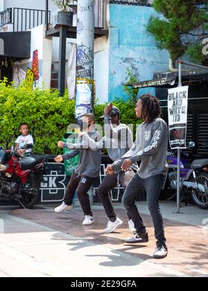 MEDELLIN, COLOMBIA - Jan 05, 2021: Medellin, Antioquia, Colombia - December 23 2020: Young Men Break Dance in Black and Grey Outfits Stock Photo