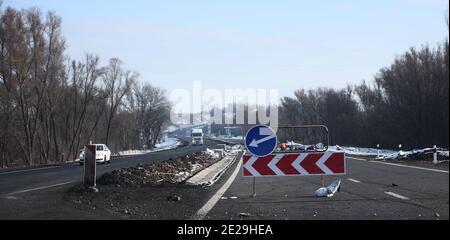 repair of roads. detour sign on the right. temporary road signs on the road.  Stock Photo