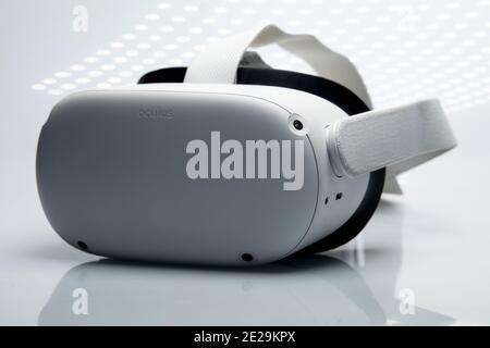 White new generation VR headset isolated on white background  with sparkling futuristic lights. Oculus Quest 2 virtual reality headset Stock Photo