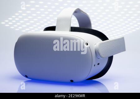 White new generation VR headset isolated on white background  with sparkling futuristic lights. Oculus Quest 2 virtual reality headset Stock Photo