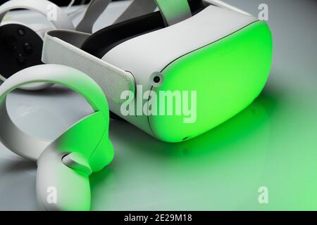 White new generation VR headset isolated on white background  with sparkling futuristic lights. Oculus Quest 2 virtual reality headset Stock Photo