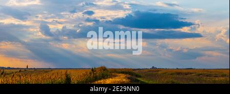 Dramatic cloudscape area landscape with rays of light. Stock Photo
