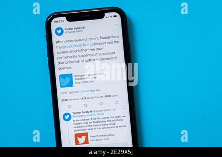 Milan, Italy - 13 January 2021: Twitter Safety account on smartphone. President Donald J. Trump account was permanently suspended on Twitter due to th Stock Photo